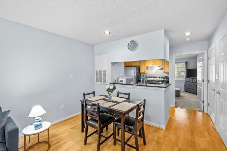Dining area with kitchen in the back.