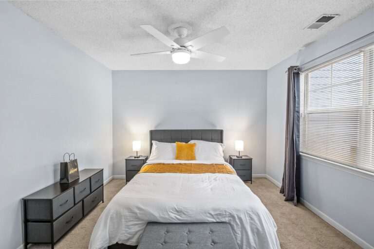 Monthly rental bedroom with night stands.
